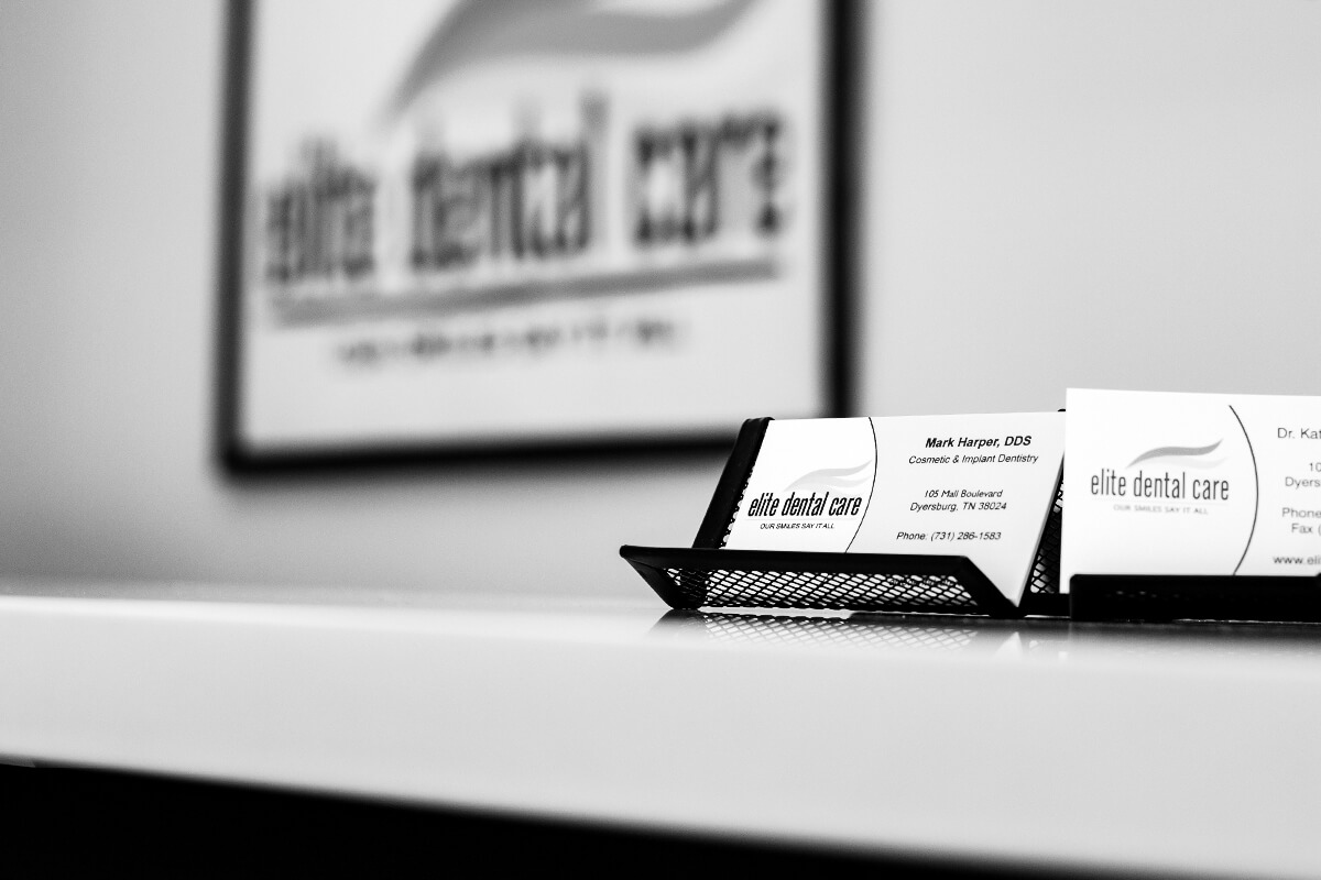 Elite Dental Business cards on front desk