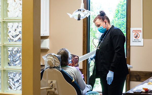 Ann Marie with a patient in the ripley office